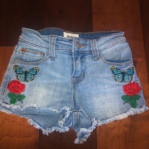 Girls short shorts with patches.